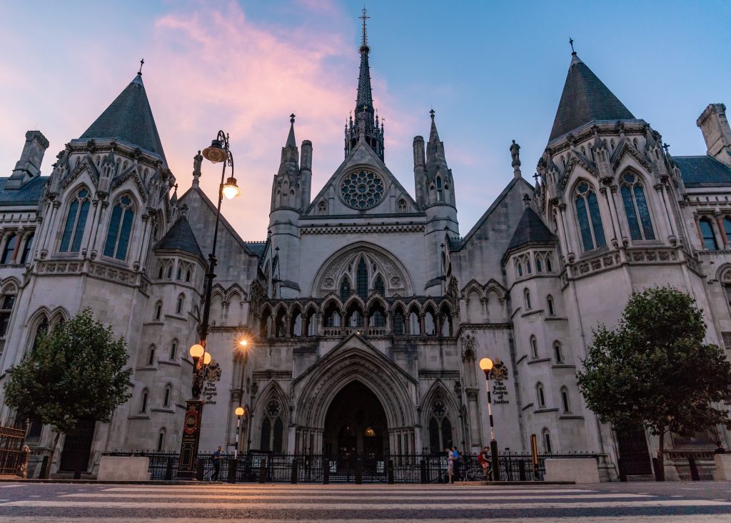 Photograph of the front of the Royal Courts of Justice in London at sunset.